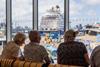 Passengers enjoying the view in the cruise lounge at Portsmouth International Port.