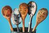 wooden and metal spoons with illustrated faces