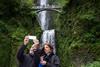 Couple taking selfie at Multnomah Falls, Oregon, USA