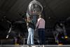 A couple stood in front of a plane