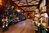 Inside of Hever Castle at Christmas decorated with colourful trees and nutcrackers