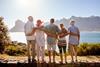 Group looking over the ocean and mountain range