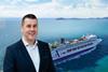 Ambassador Cruise Line CCO Phil Gardner with Ambience in the background
