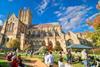 People sat on the lawns outside the Cathedral during a festival