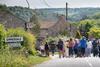 A group on a walking tour of Emmerdale Village in the Yorkshire Dales.