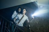 Couple going down stairs with torch and baseball bat