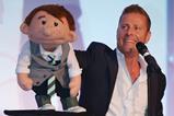Ventriloquist Paul Zerdin with his puppet Sam on stage