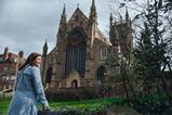 A lady looks out at Worcester Cathedral