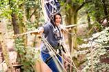 A women on a Treetop Adventure Course at Go Ape