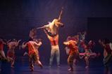 Some of the cast of Sadler's Wells' Message In A Bottle dance show seen on the stage.