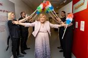 Anne, Lady Dodd officially opens Happiness! The Ken Dodd Exhibition under an arch of tickling sticks!