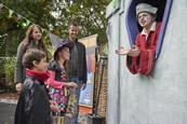 Children and their parents explore spooky displays as part of Legoland's Brick or Treat event