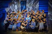 Mazz Murray (centre) as Donna with the cast of Mamma Mia at the Novello Theatre
