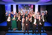 The winners of the 2024 GLT Awards show off their trophies with host Pete Firman