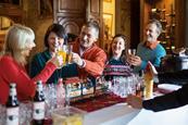 A group celebrate a Christmas drink at Warner Leisure Hotel's Thoresby Hall