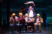 Some of the cast from the Come from Away musical pictured on stage during one of the scenes.