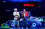 Roger Bart (as Doc Brown) and Axel Duffy (as Marty McFly)