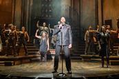 Zachary James and the company in Hadestown