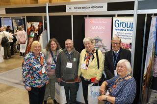 Visitors and exhibitors interact at the GLT Show