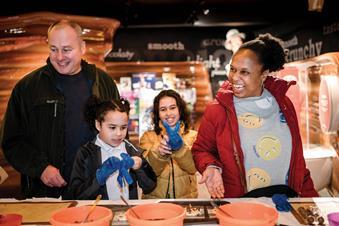 A family make chocolate at York's Chocolate Story