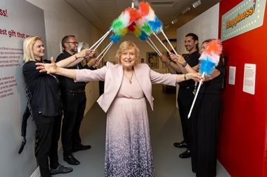 Anne, Lady Dodd officially opens Happiness! The Ken Dodd Exhibition under an arch of tickling sticks!