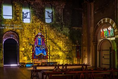 A projection on the wall at Norwich Castle Keep telling the story of the building of Norwich Castle