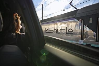 A woman looks out of LeShuttle