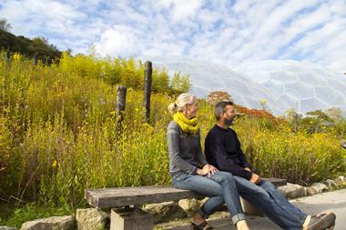 A couple admire the scenery at Eden Project in Cornwall