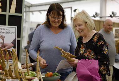 Visitors look at some of the items for sale at the Living Crafts festival in Hertfordshire