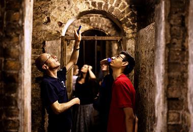 A guide from London Transport Museum shows a group around Baker Street tube station as part of a Hidden London tour