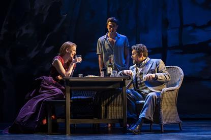 Cast members of Aspects of Love sat around the table. From left: Lauar Pitt-Pulford as Rose Vibert, Jamie Bogyo as Alex Dillingham and Michael Ball as George Dillingham.
