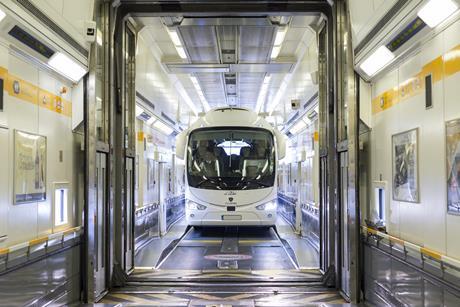 A coach boards LeShuttle