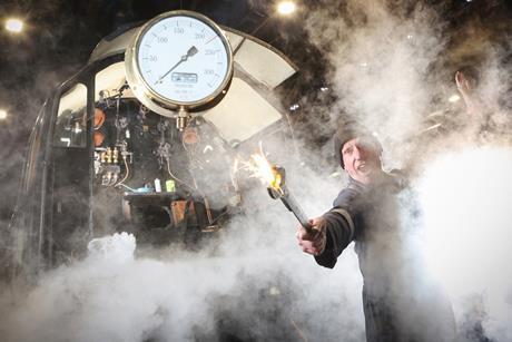 A train driver with lots of steam at the North Yorkshire Moors Railway