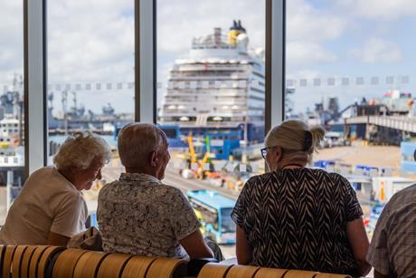 Passengers enjoying the view in the cruise lounge at Portsmouth International Port. 