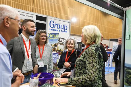 Visitors and exhibitors chat at the Group Leisure & Travel Show 2023 in Milton Keynes