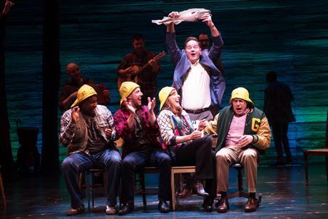 Some of the cast from the Come from Away musical pictured on stage during one of the scenes.