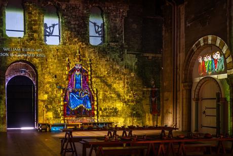A projection on the wall at Norwich Castle Keep telling the story of the building of Norwich Castle