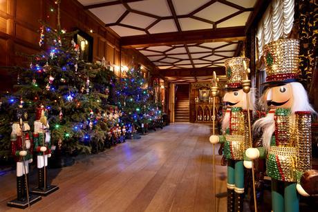 Inside of Hever Castle at Christmas decorated with colourful trees and nutcrackers