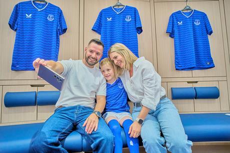 A family take a selfie during an Everton Football Club Stadium Tour