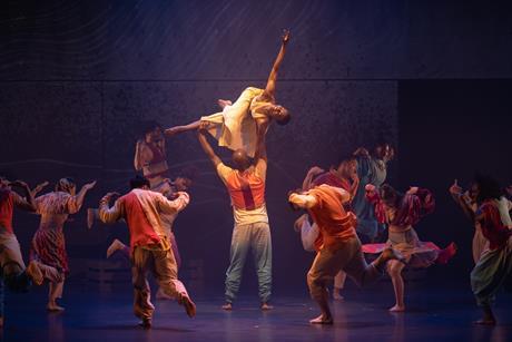 Some of the cast of Sadler's Wells' Message In A Bottle dance show seen on the stage.