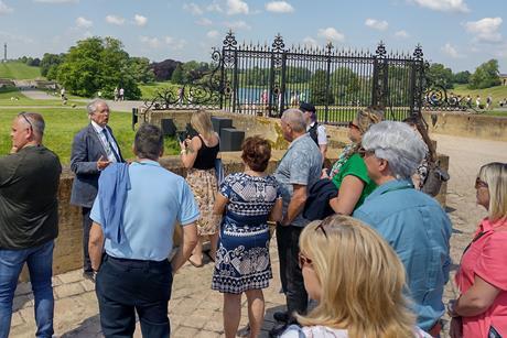Members of the Coach Tourism Association enjoying a tour of Blenheim Palace's gardens in Oxfordshire