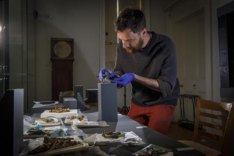 Dr Adam Parker with the Melsonby Hoard at the Yorkshire Museum.