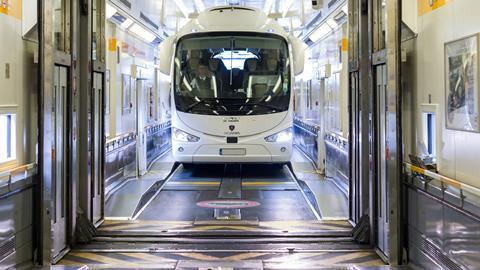 A coach boards LeShuttle