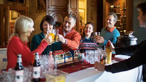 A group celebrate a Christmas drink at Warner Leisure Hotel's Thoresby Hall