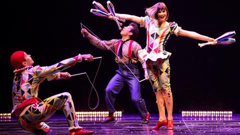 Performers juggling in the Cirque du Soleil's Corteo show