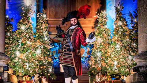 A man dressed as Captain Hook in front of Christmas trees at Blenheim Palace