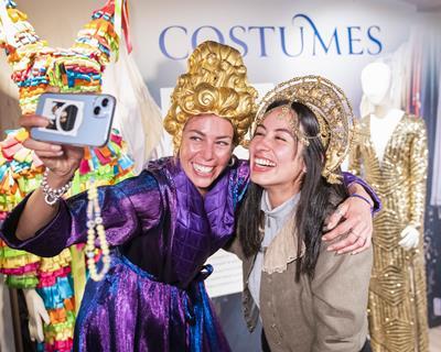 Two women dress up in Shakespeare outfits at Shakespeare's Globe Theatre