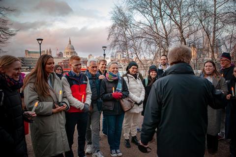 A group have a Twilight Tour with a Shakespeare's Globe guide