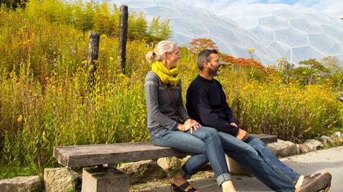 A couple admire the scenery at Eden Project in Cornwall