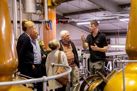 A group having a tour of Penderyn Distillery